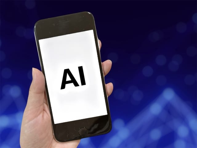 スマートフォン画面に「AI」と表示された画像。AI社会の到来によって婚活条件や結婚観が変化していく未来を表現
